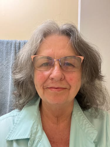 Reviewer's self-portrait showing the moisturizing effect of the Grass Fed Tallow & Honey Balm on her skin.