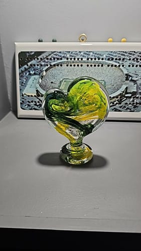 Reviewer's standing Glass Heart with Cremains, showing the custom green and yellow swirls mentioned in the review.