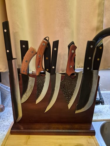 Customer's Ronin 11" Slicing Knife in a wooden block, part of a large collection of various knives.