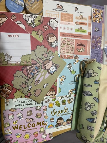 Customer's new Just Peachy Planner Kit laid out with other colorful planner supplies from their purchase.