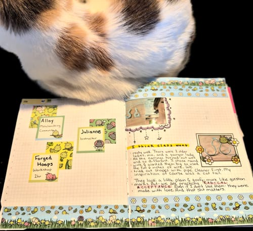 Customer's open journal decorated with cute stickers and washi tape from the Ultimate Subscription.