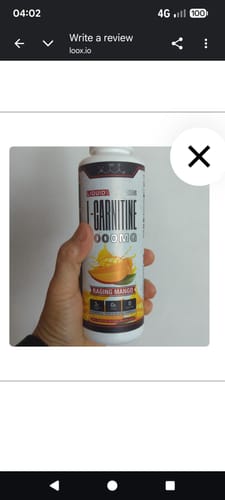 Customer holding a white bottle of Liquid L-Carnitine 4000MG in Raging Mango flavor.