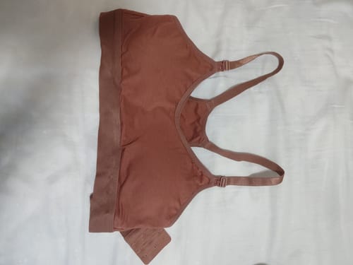 Customer's terracotta Skye Pump Bra with a racerback design, laid flat on a white surface.