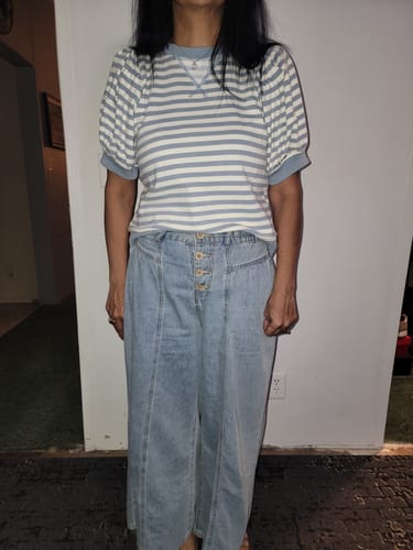 Reviewer showing the front fit of the Striped Solid Trim Puffed Sleeve Tee in a size medium.