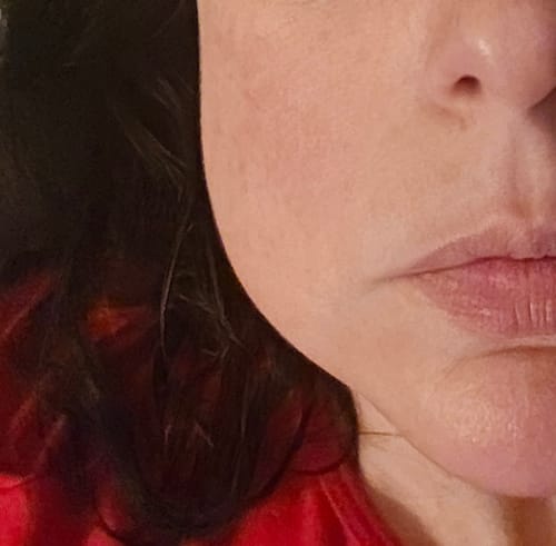 Close-up: Reviewer's face showing smooth, hydrated skin after using the Neptune Ultimate Moisture Duo.