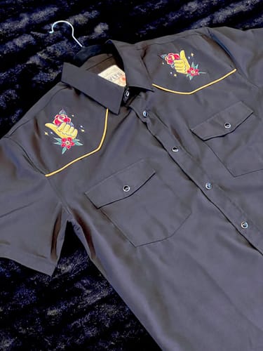 Customer's black Roper Short Sleeve Shirt, showing the detailed flash tattoo-style embroidery on the front yokes.