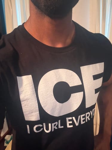 Reviewer wearing the black I Curl Everyday T-Shirt with large 'ICE' text across the chest.
