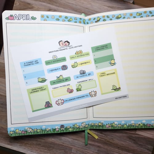 Customer shows the Gratitude Prompts Cute Critters sticker sheet laid across an open, decorated planner.