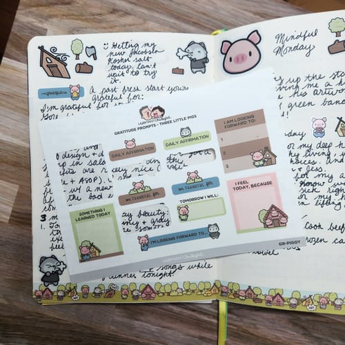 Customer displays the Gratitude Prompts Three Little Pigs Theme sticker sheet over an open, decorated journal.
