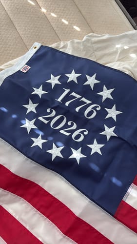 Customer's 1776 to 2026 Betsy Ross Flag laid out, showing the embroidered stars and dates on the blue canton.