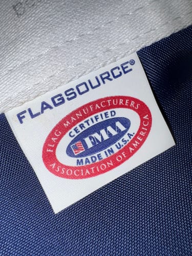 Close-up: Customer photo of the certified 'Made in U.S.A.' tag on the 1776 to 2026 Betsy Ross Flag.