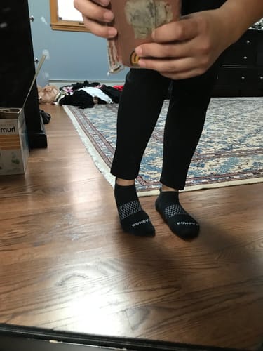 Reviewer showing the ankle-length fit of the black Frost Petite Duralite® Leggings.
