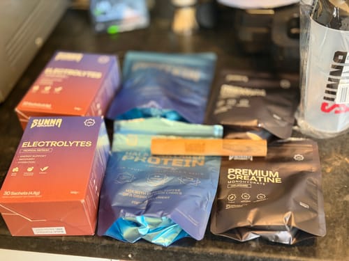 Customer's order of Sunna brand electrolytes, protein, and other supplements displayed on a countertop.