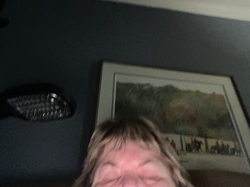 Partial view of a reviewer's face with eyes closed, showing the results of the Grass Fed Tallow & Honey Balm.