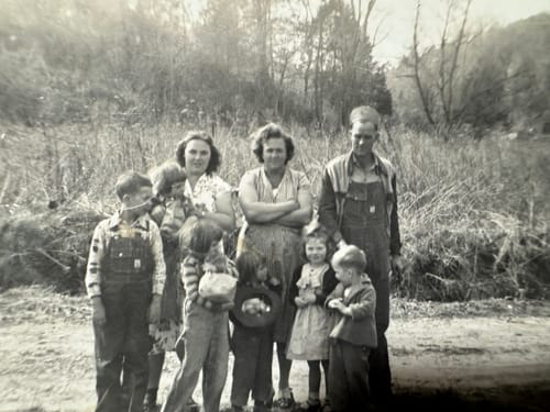 Customer's submitted black and white photo of a group of people outdoors.