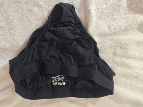 A customer's pair of black Brushed Nylon Briefs turned inside out, showing the interior tag.