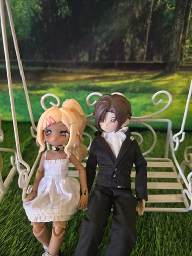 Customer's Zack doll wearing the black Coming-of-age Ceremony clothing set while sitting on a white swing.