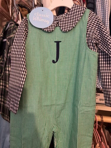Customer's Classic Gingham Longall Green with a 'J' monogram, layered over a black and white gingham shirt.