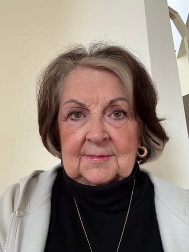 Reviewer showing her smooth facial skin after using the Deep Collagen Cream.