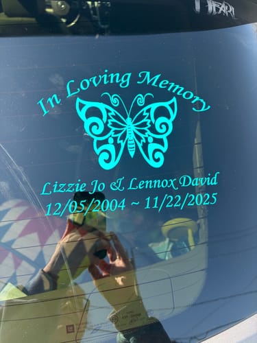 Customer's teal Butterfly In Loving Memory decal applied to the rear window of a car.