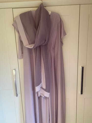 Customer's lovely lilac silk dress with front tucks and a matching scarf hanging up.