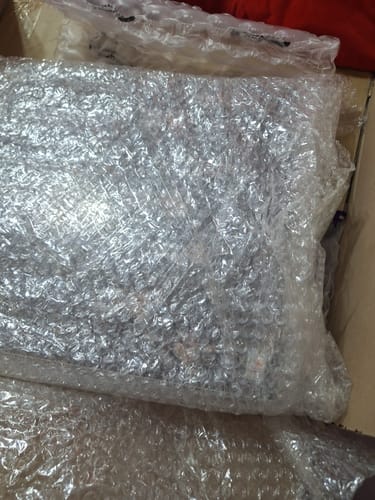 Customer's BTS vinyl set shown in its protective bubble wrap packaging inside a box.