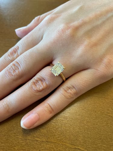 Customer photo review of Ira 2.5 Carat Emerald Cut Solitaire Moissanite Engagement Ring in 18k Yellow Gold