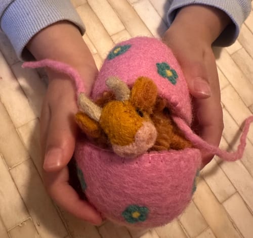 Customer photo review of Felt Purple Surprise Egg with Highland Cow Toy Inside