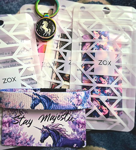 Customer's Unicorn Pack, showing the 'Stay Majestic' bracelet and card, keychain, and other packaged bracelets.