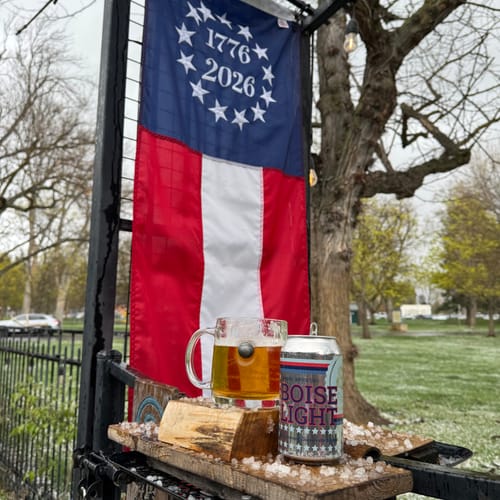 Customer's Betsy Ross pull-down flag from the decor kit hanging vertically on an outdoor post.