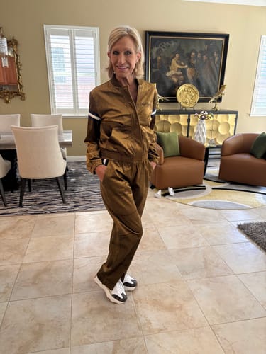 Reviewer standing in the bronze brown Women's Cordurato Track Pant with the matching jacket.