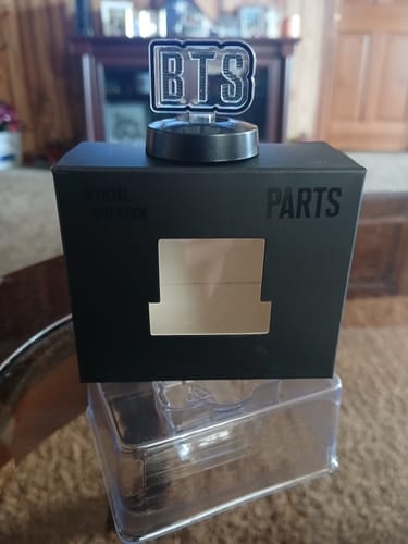 Customer's BTS Official Light Stick Part with the BTS logo displayed on top of its original black packaging.