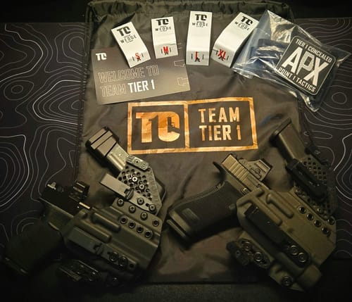Customer's two APX holsters displayed with branded accessories on a Tier 1 bag.