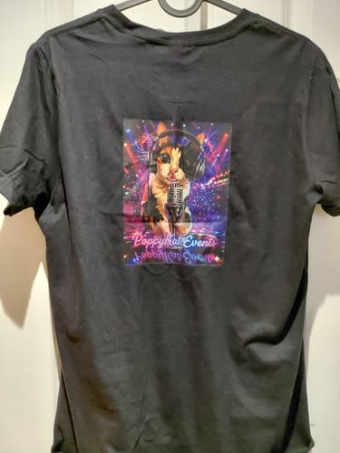 Customer's black fitted t-shirt with a colorful 'PoppyKat Events' graphic printed on the back.