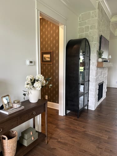 Customer's view of the Dovie Wallpaper by Katie Burt Art creating a lovely accent in a hallway.