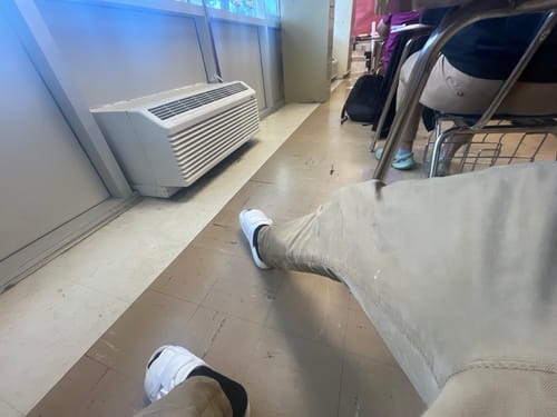 Customer's first-person view of their white Mystery DracoSlides being worn indoors.
