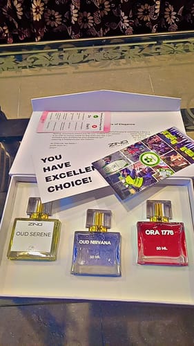 Customer's OUD Supreme BUNDLE showing the three colorful perfume bottles in their white presentation box.