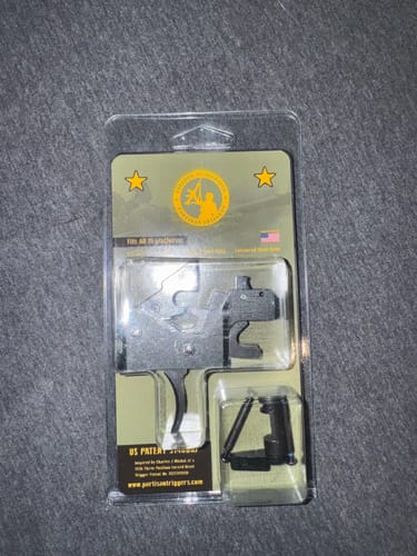 Customer's Partisan FRT trigger in its original packaging with a green backing card.