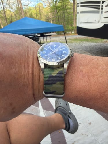 Customer wearing the military-style Camo Jungle watch strap from the Veterans Bundle outdoors.