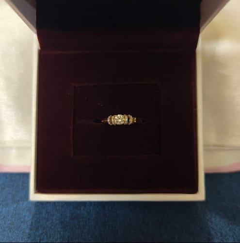 Customer's Gold Stunning Diamond Ring presented in its dark, velvet-lined gift box.