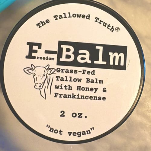 Close-up of the reviewer's F-Balm jar lid, showing the product's distinctive label.
