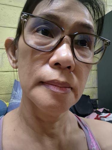 Reviewer's close-up photo of her face, showing her hydrated skin after using the Bad Skin™ Collagen Bomb Ampoule.