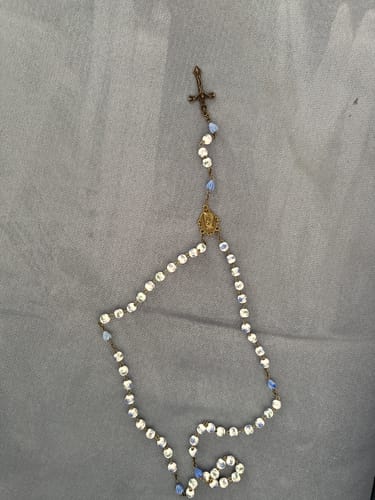 Customer's beautiful Immaculate Heart of Mary Rosary with white and blue beads and a crucifix, displayed on a gray surface.