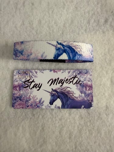 Customer's Stay Majestic Bracelet and its unicorn-themed card laid out for comparison on a white surface.