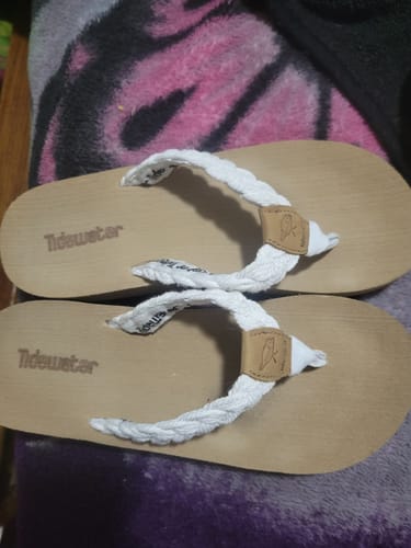 Customer's Harbor White flip flops with white braided straps and light brown footbeds.
