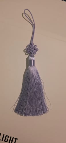 Customer's silky lavender BTS Tassel Norigae with its decorative knot and hanging loop.