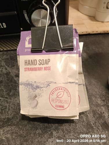 Customer's stack of Dazz Hand Soap refill tablets in Strawberry Rose scent, clipped together on a counter.
