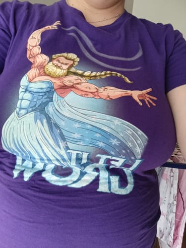 Reviewer wearing the purple Swollen T-Shirt, showing the fit and the muscular parody graphic.