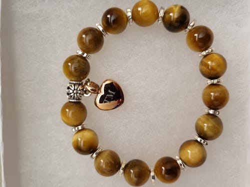 Customer's Golden Honey Tiger Eye Bracelet with an engraved, rose gold keepsake heart charm.