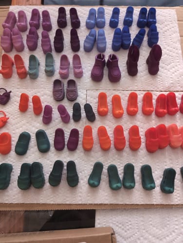 Customer's colorful, dyed shoes from the Transform Electrical Street Accessories set, laid out neatly in rows.